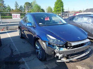 2023 Tesla Model Y Long Range with VIN 7SAYGDEE0PF762592, listed as a IAAI auction lot 41983933 with 28,510 mi miles and . Bid and sale history available at carsss.com. Image 1.