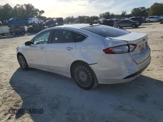 2013 Ford Fusion Titanium Hybrid with VIN 3FA6P0RU2DR277773, listed as a Copart auction lot 85990424 with 215,289 mi miles and Non Repairable. Bid and sale history available at DreamBid. Image 2.