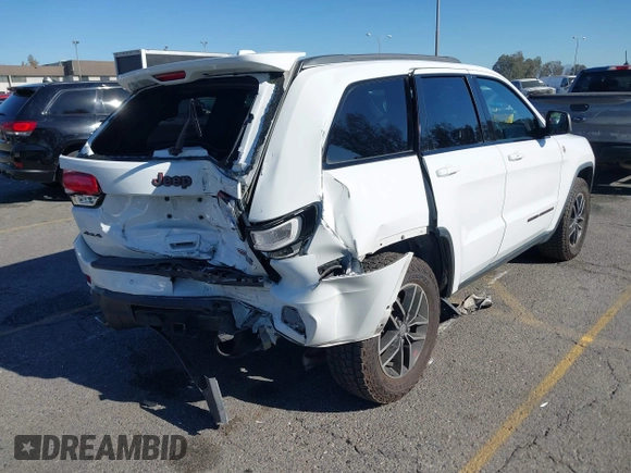 2017 Jeep Grand Cherokee Trailhawk with VIN 1C4RJFLGXHC959092, listed as a IAAI auction lot 41232281 with 108,659 mi miles and . Bid and sale history available at DreamBid. Image 4.