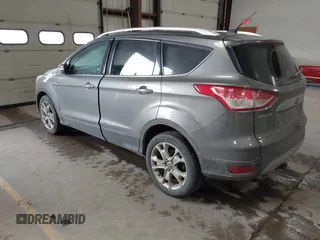 2014 Ford Escape Titanium with VIN 1FMCU9J90EUC31625, listed as a IAAI auction lot 41492075 with 301,917 mi miles and . Bid and sale history available at DreamBid. Image 3.