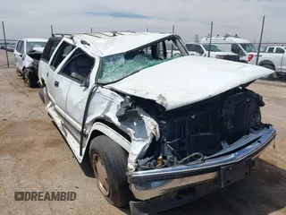 1999 GMC Suburban with VIN 1GDFK16R0XJ728255, listed as a IAAI auction lot 42230595 with Not provided miles and . Bid and sale history available at DreamBid. Image 6.