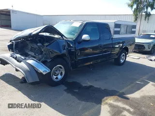 2002 Ford F-150 XL with VIN 1FTRX17L02NB79722, listed as a IAAI auction lot 41538404 with 202,050 mi miles. Bid and sale history available at carsss.com. Image 2.