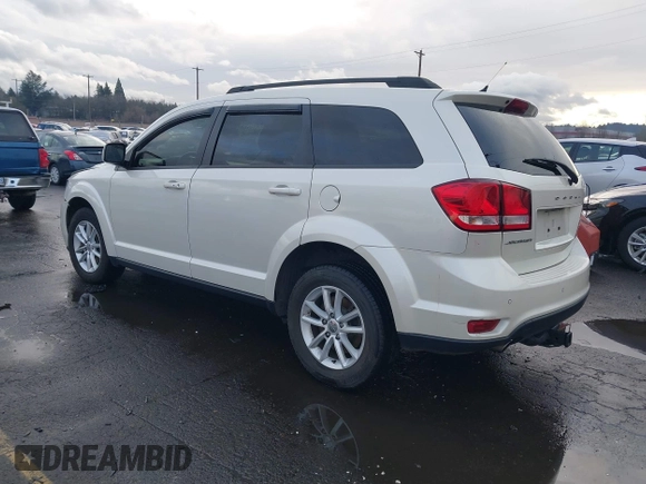 2014 Dodge Journey SXT with VIN 3C4PDCBGXET182430, listed as a IAAI auction lot 41599489 with 143,889 mi miles. Bid and sale history available at carsss.com. Image 3.