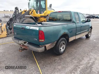1997 Ford F-150 XL with VIN 1FTEX17LXVNC32588, listed as a IAAI auction lot 40848063 with 210,113 mi miles and . Bid and sale history available at DreamBid. Image 4.