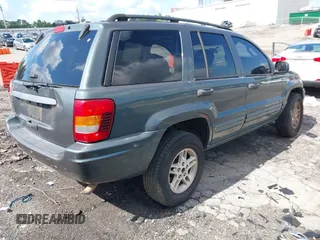 2004 Jeep Grand Cherokee Laredo with VIN 1J4GX48S34C192181, listed as a IAAI auction lot 42320368 with 181,415 mi miles and . Bid and sale history available at DreamBid. Image 4.