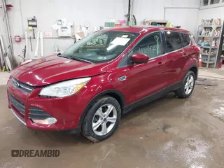 2013 Ford Escape SE with VIN 1FMCU9GX1DUC56361, listed as a IAAI auction lot 42042233 with 136,441 mi miles and . Bid and sale history available at DreamBid. Image 2.