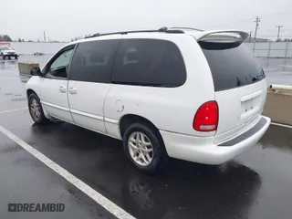 1999 Dodge Caravan SE with VIN 2B4GP44GXXR285795, listed as a IAAI auction lot 41850278 with 2,552,594 mi miles. Bid and sale history available at carsss.com. Image 3.