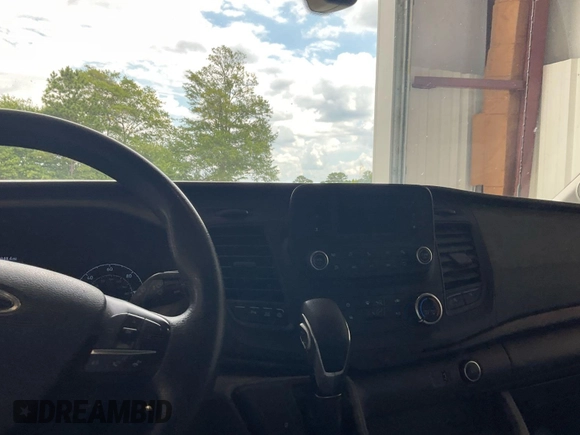 2021 Ford Transit Cargo with VIN 1FTBR1CG4MKA80751, listed as a IAAI auction lot 42859733 with 80,844 mi miles and . Bid and sale history available at DreamBid. Image 13.