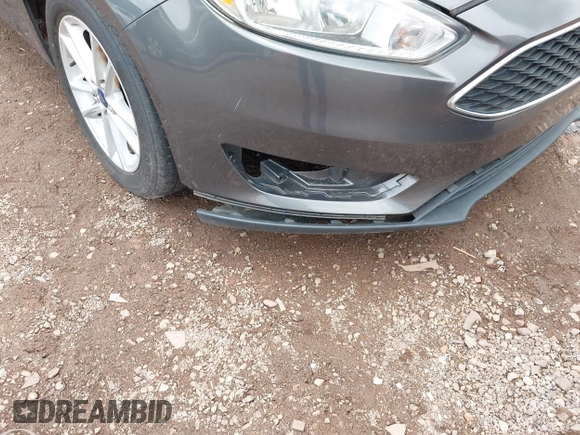 2016 Ford Focus SE z VIN 1FADP3F2XGL397092, wystawiony jako IAAI lot #42619802 z przebiegiem 232 252 mil mil oraz . Historia ofert i sprzedaży dostępna na DreamBid. Obrazek 6.