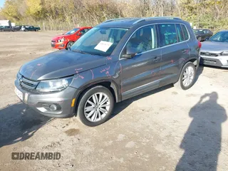 2012 Volkswagen Tiguan SEL with VIN WVGAV7AX2CW000962, listed as a IAAI auction lot 40815475 with 162,859 mi miles and . Bid and sale history available at DreamBid. Image 2.
