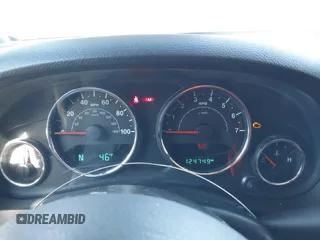 2016 Jeep Wrangler Rubicon z VIN 1C4BJWCGXGL307542, wystawiony jako IAAI lot #41407411 z przebiegiem 124 749 mil mil oraz . Historia ofert i sprzedaży dostępna na DreamBid. Obrazek 7.