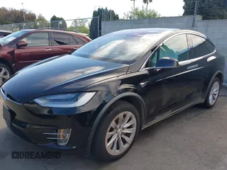 2020 Tesla Model X Long Range with VIN 5YJXCDE20LF265157, listed as a IAAI auction lot 41809572 with 58,599 mi miles. Bid and sale history available at carsss.com. Image 6.