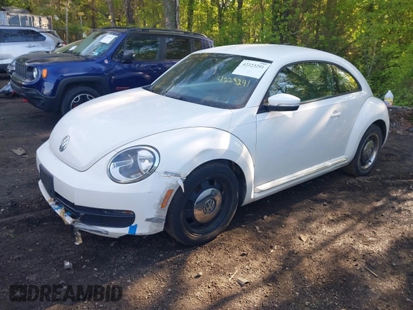 2012 Volkswagen Beetle 2.5L w/Sound/Nav PZEV with VIN 3VWJP7AT1CM619318, listed as a IAAI auction lot 42223291 with 85,989 mi miles and . Bid and sale history available at DreamBid. Image 2.