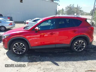 2016 Mazda CX-5 Grand Touring with VIN JM3KE2DY3G0686588, listed as a IAAI auction lot 41697312 with 65,090 mi miles. Bid and sale history available at carsss.com. Image 14.