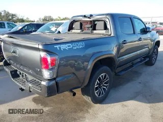 2023 Toyota Tacoma 4WD SR with VIN 3TMCZ5AN7PM587833, listed as a IAAI auction lot 41853887 with 16,532 mi miles. Bid and sale history available at carsss.com. Image 4.