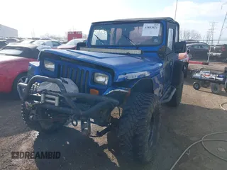 1995 Jeep Wrangler S with VIN 1J4FY19P3SP260597, listed as a IAAI auction lot 41883021 with 176,555 mi miles. Bid and sale history available at carsss.com. Image 6.