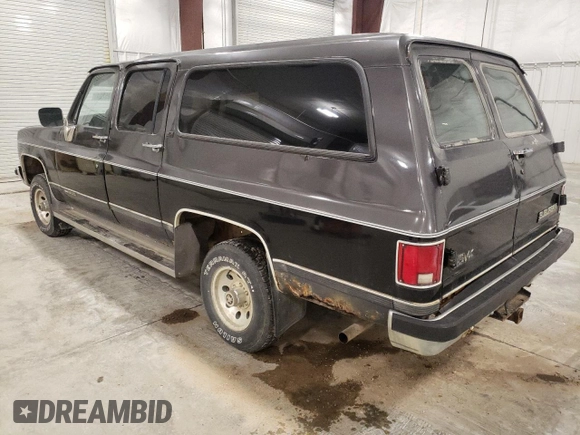 1991 GMC Suburban z VIN 1GKEV16K5MF500359, wystawiony jako Copart lot #81125224 z przebiegiem 177 181 mil mil oraz Czysty tytuł • Clean title. Historia ofert i sprzedaży dostępna na DreamBid. Obrazek 2.