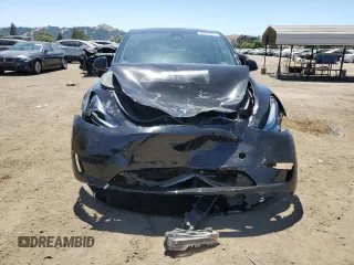 2024 Tesla Model Y Long Range with VIN 7SAYGAEE9RF125458, listed as a Copart auction lot 59567365 with 28,966 mi miles and Salvage title. Bid and sale history available at DreamBid. Image 5.