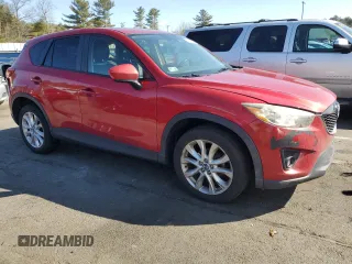 2014 Mazda CX-5 Grand Touring with VIN JM3KE4DY8E0421660, listed as a Copart auction lot 48588525 with 144,939 mi miles and Salvage Title. Bid and sale history available at DreamBid. Image 4.