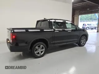 2023 Honda Ridgeline RTL-E with VIN 5FPYK3F79PB038896, listed as a Copart auction lot 58401225 with 23,531 mi miles and Clean title. Bid and sale history available at DreamBid. Image 3.