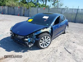 2019 Tesla Model 3 Mid Range with VIN 5YJ3E1EA6KF402308, listed as a IAAI auction lot 40077902 with 89,794 mi miles and . Bid and sale history available at carsss.com. Image 19.