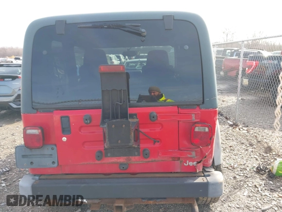 2003 Jeep Wrangler Sport with VIN 1J4FA49S53P305096, listed as a IAAI auction lot 41685209 with 165,247 mi miles. Bid and sale history available at carsss.com. Image 16.