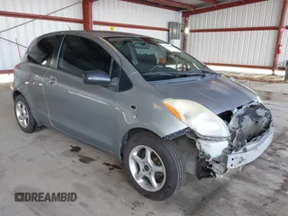 2009 Toyota Yaris with VIN JTDJT903095254673, listed as a IAAI auction lot 41830459 with 320,449 mi miles. Bid and sale history available at carsss.com. Image 1.