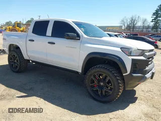 2024 Chevrolet Colorado 4WD Trail Boss with VIN 1GCPTEEK5R1320242, listed as a IAAI auction lot 41823557 with 4,768 mi miles and . Bid and sale history available at DreamBid. Image 1.