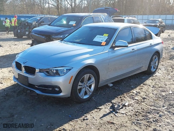 2018 BMW 3 Series 330i with VIN WBA8B9G58JNU97318, listed as a IAAI auction lot 41205434 with 62,582 mi miles. Bid and sale history available at carsss.com. Image 2.