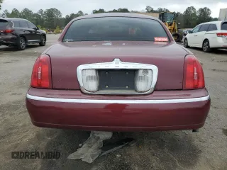 1999 Lincoln Town Car Executive z VIN 1LNHM81W5XY655075, wystawiony jako Copart lot #43263935 z przebiegiem Nie podano mil oraz Szkoda całkowita • Salvage title. Historia ofert i sprzedaży dostępna na DreamBid. Obrazek 6.