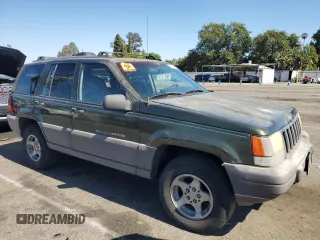 1996 Jeep Grand Cherokee Laredo with VIN 1J4FX58S1TC169501, listed as a Copart auction lot 59143174 with 0 mi miles and Salvage Title. Bid and sale history available at carsss.com. Image 4.