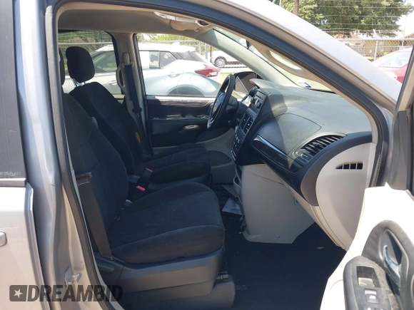 2013 Dodge Grand Caravan SE with VIN 2C4RDGBG0DR702913, listed as a IAAI auction lot 42007786 with 163,981 mi miles and . Bid and sale history available at DreamBid. Image 5.