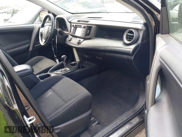 2018 Toyota RAV4 XLE with VIN 2T3RFREV1JW697044, listed as a IAAI auction lot 41891412 with 140,145 mi miles. Bid and sale history available at carsss.com. Image 5.