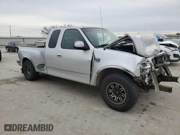 2000 Ford F-150 XL with VIN 1FTRX07L2YKA09673, listed as a Copart auction lot 48177615 with Not provided miles and Salvage title. Bid and sale history available at DreamBid. Image 4.