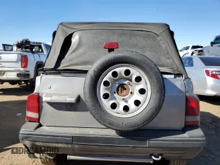 1995 Chevrolet Tracker z VIN 2CNBJ186XS6926688, wystawiony jako Copart lot #77487204 z przebiegiem 17 598 mil mil oraz Szkoda całkowita • Salvage title. Historia ofert i sprzedaży dostępna na DreamBid. Obrazek 6.