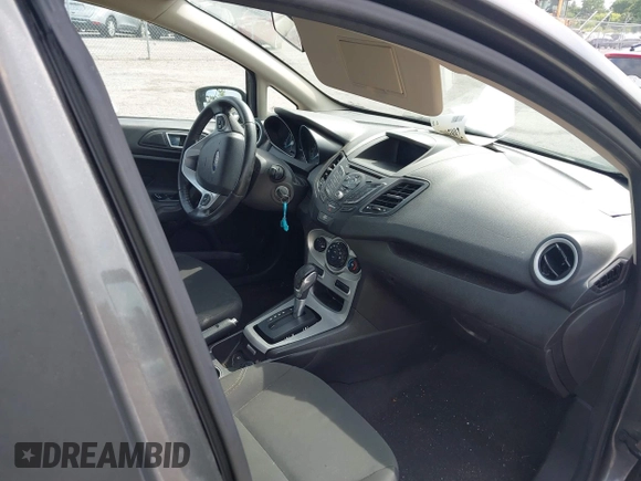 2016 Ford Fiesta SE with VIN 3FADP4EJ4GM129006, listed as a IAAI auction lot 42085892 with 146,044 mi miles. Bid and sale history available at carsss.com. Image 5.