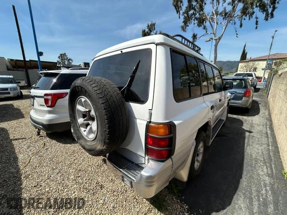 2000 Mitsubishi Montero z VIN JA4MR51R6YJ002305, wystawiony jako Copart lot #50263015 z przebiegiem 138 861 mil mil oraz Czysty tytuł • Clean title. Historia ofert i sprzedaży dostępna na DreamBid. Obrazek 4.