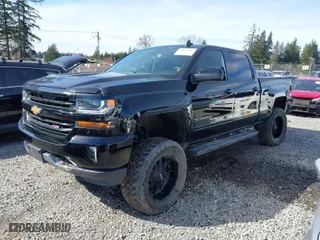 2016 Chevrolet Silverado 1500 LT with VIN 3GCUKREC0GG306088, listed as a IAAI auction lot 41870097 with 203,563 mi miles. Bid and sale history available at carsss.com. Image 2.