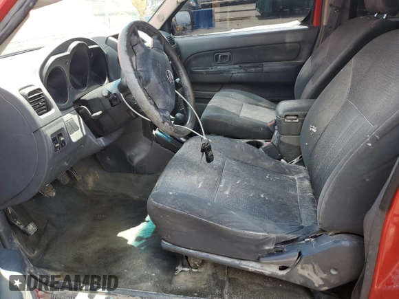 2002 Nissan Frontier XE with VIN 1N6ED29Y12C388949, listed as a Copart auction lot 55235875 with 212,944 mi miles and Salvage title. Bid and sale history available at DreamBid. Image 7.