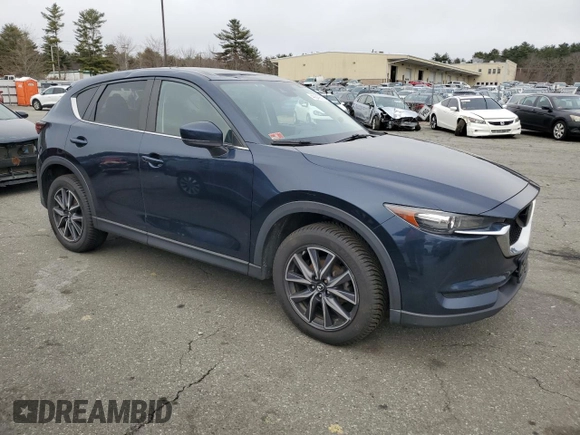 2018 Mazda CX-5 Touring with VIN JM3KFBCM9J0433729, listed as a Copart auction lot 49945515 with 143,064 mi miles and Salvage Title. Bid and sale history available at carsss.com. Image 4.