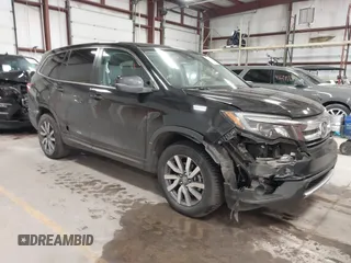 2019 Honda Pilot EX-L with VIN 5FNYF6H5XKB067858, listed as a IAAI auction lot 41643807 with 102,114 mi miles and . Bid and sale history available at carsss.com. Image 1.