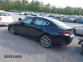 2021 Mazda 3 Premium z VIN 3MZBPADL2MM254467, wystawiony jako IAAI lot #42151557 z przebiegiem 63 282 mil mil oraz . Historia ofert i sprzedaży dostępna na DreamBid. Obrazek 3.