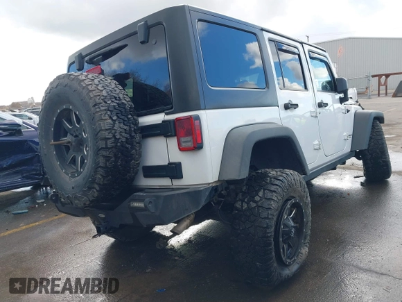 2014 Jeep Wrangler Unlimited Rubicon with VIN 1C4BJWFG2EL264792, listed as a IAAI auction lot 40938380 with 145,886 mi miles. Bid and sale history available at carsss.com. Image 4.