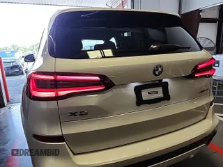 2023 BMW X5 xDrive40i with VIN 5UXCR6C00P9R65110, listed as a IAAI auction lot 42635441 with 32,227 mi miles and . Bid and sale history available at DreamBid. Image 4.