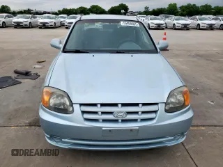 2003 Hyundai Accent GL z VIN KMHCG45C73U481294, wystawiony jako Copart lot #55958005 z przebiegiem 136 964 mil mil oraz Czysty tytuł • Clean title. Historia ofert i sprzedaży dostępna na DreamBid. Obrazek 5.