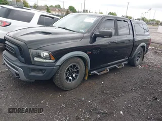 2016 Ram 1500 Rebel z VIN 1C6RR7YT0GS100285, wystawiony jako IAAI lot #42346719 z przebiegiem 103 309 mil mil oraz . Historia ofert i sprzedaży dostępna na DreamBid. Obrazek 2.