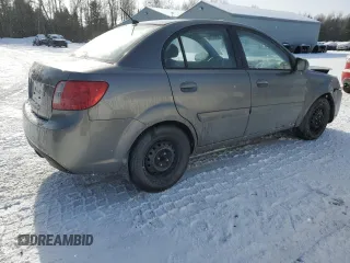 2011 Kia Rio with VIN KNADH4B32B6915325, listed as a Copart auction lot 86824074 with 167,410 mi miles and Salvage Title. Bid and sale history available at DreamBid. Image 3.