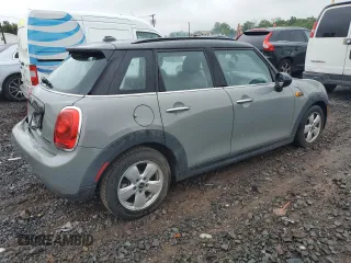 2016 MINI Hardtop 4 Door with VIN WMWXU1C53G2D08231, listed as a Copart auction lot 61050035 with 128,267 mi miles and Salvage title. Bid and sale history available at DreamBid. Image 3.