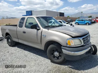 2001 Ford F-150 with VIN 1FTPX17L21NA37619, listed as a Copart auction lot 56922485 with 212,148 mi miles and Salvage title. Bid and sale history available at DreamBid. Image 4.