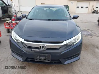 2017 Honda Civic LX z VIN 19XFC2F52HE028823, wystawiony jako IAAI lot #41312009 z przebiegiem 56 462 mil mil oraz . Historia ofert i sprzedaży dostępna na DreamBid. Obrazek 12.